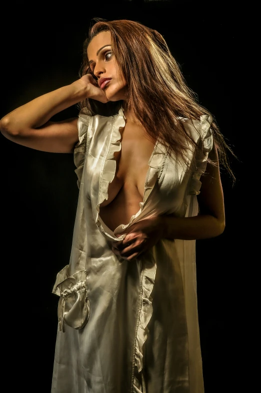 this is an artistic image of a woman in a silk dress