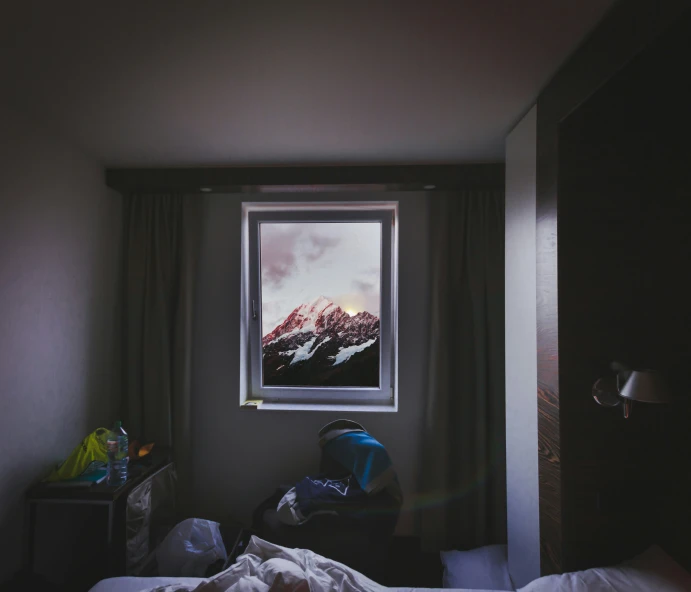 the mountain view is framed by a window