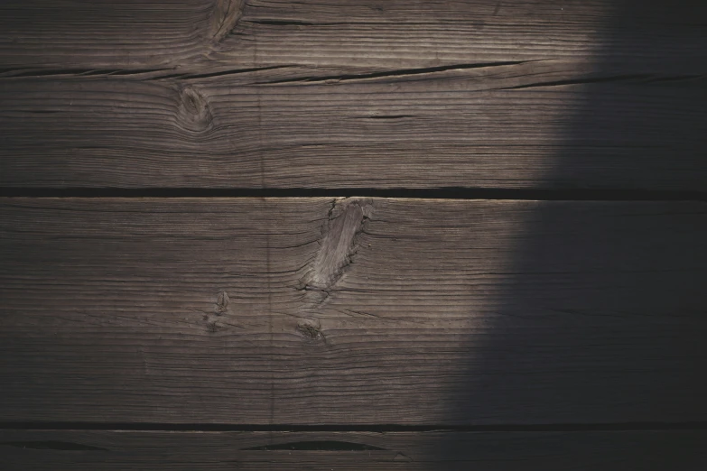 shadow of a man on a wooden floor