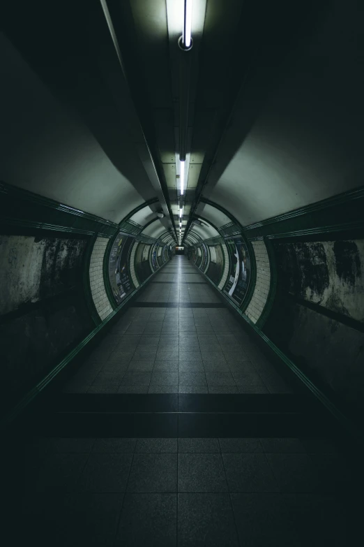 a tunnel with many lights going through it