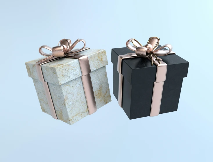 a pair of black and gold wrapped gift boxes