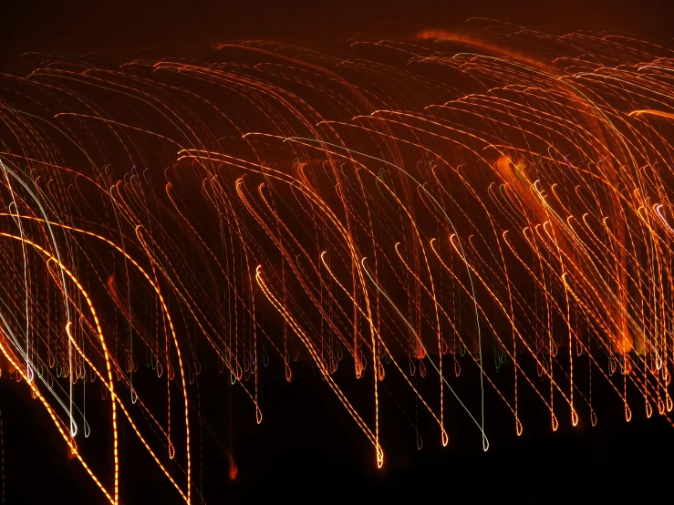 a group of firework are shown at night