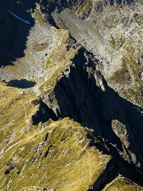 the top view of a mountain range with a valley below