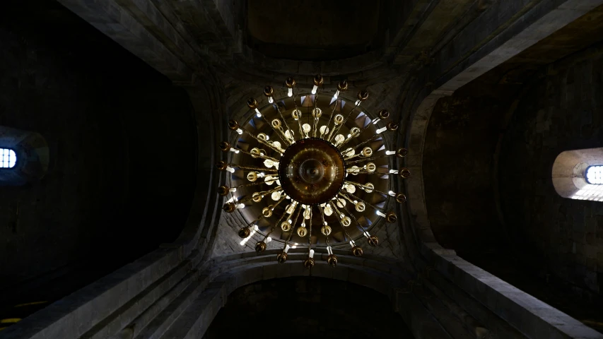 the lights on the ceiling of the building reflect sunlight