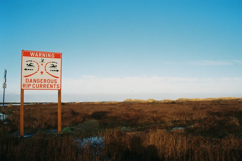 there is a warning sign for dangerous water sources