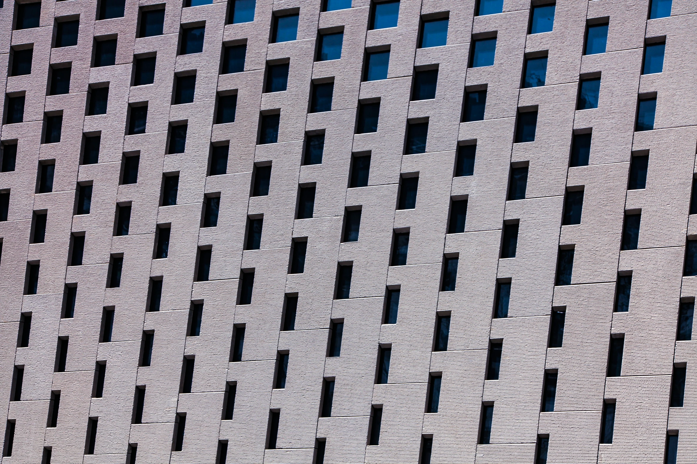 a very modern building made of wavy bricks