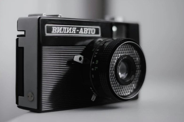 a camera sitting on top of a white surface