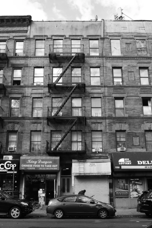 a black and white po of an old building and street