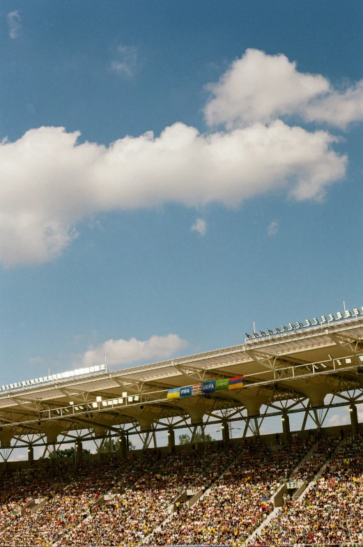 the sky above a soccer field with a large roof