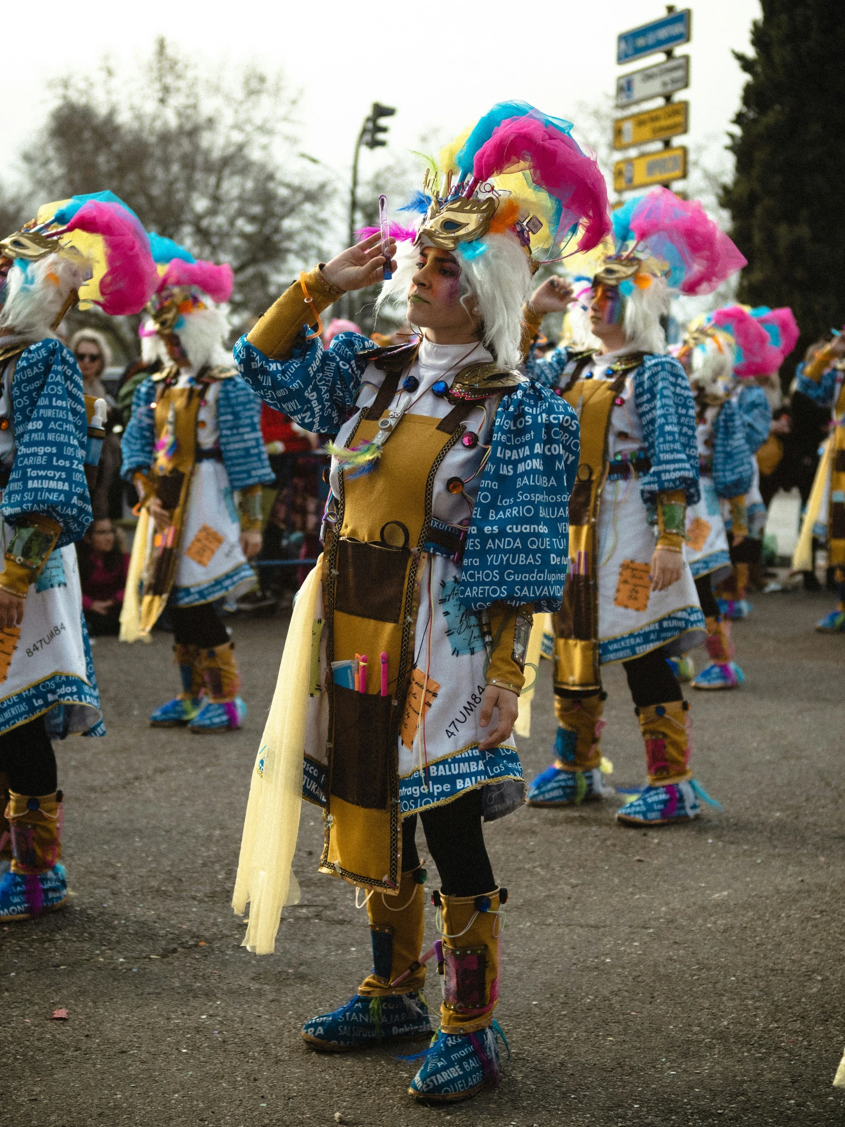 several people dressed in brightly colored costumes