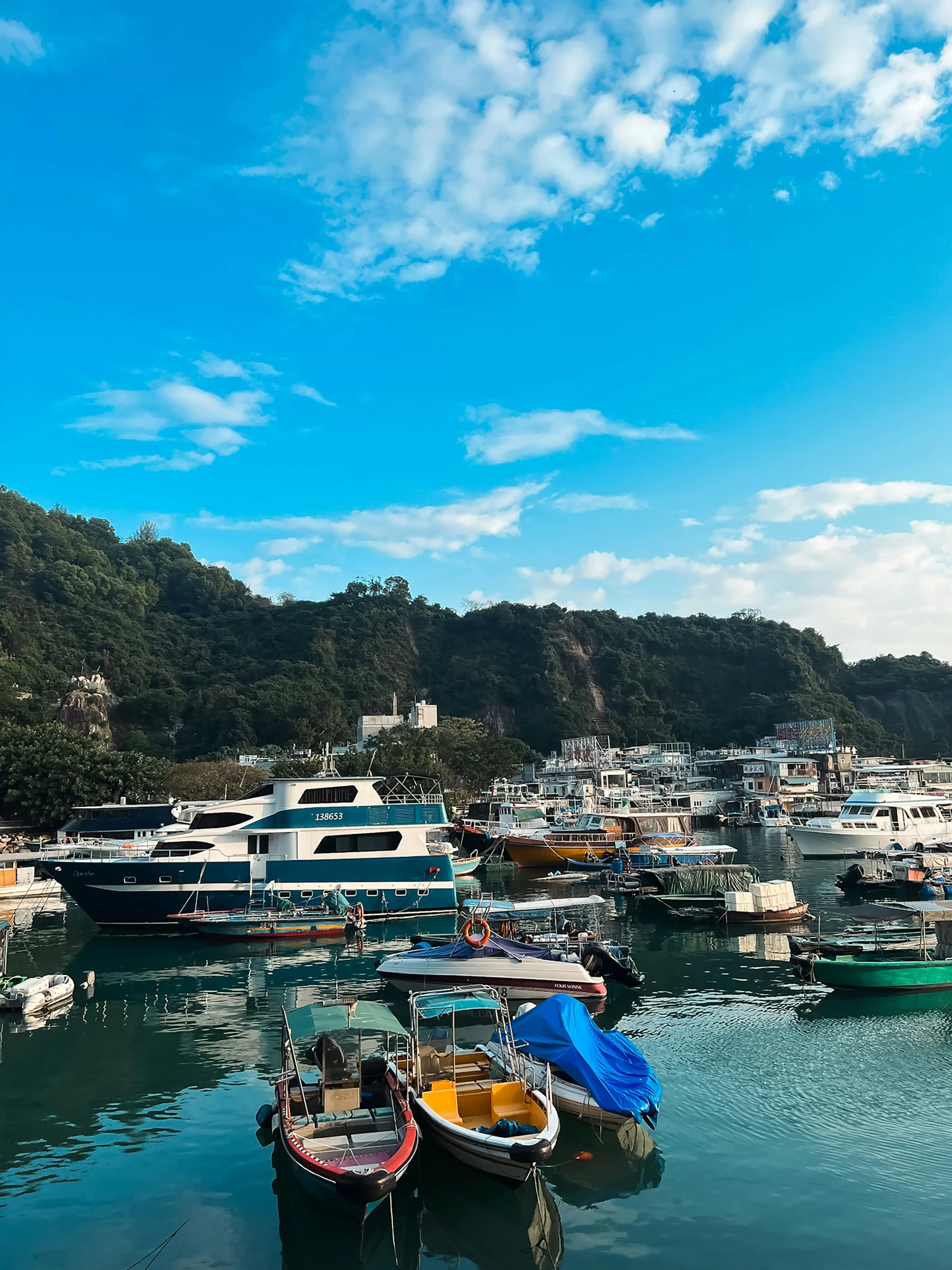 boats docked next to each other in the water