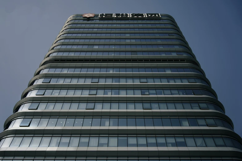 a tall building with a flag on the roof