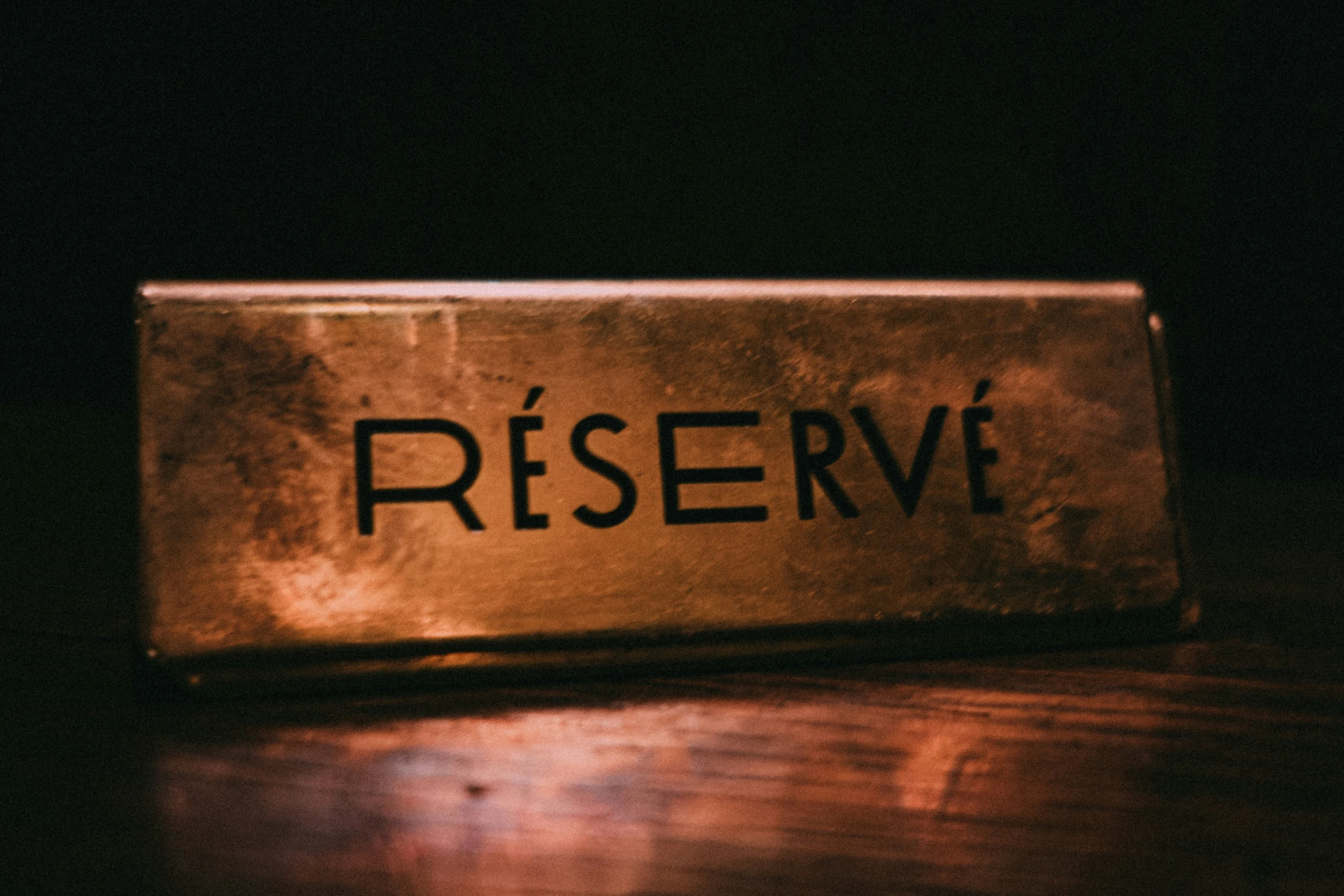 a desk name plate that reads reserved