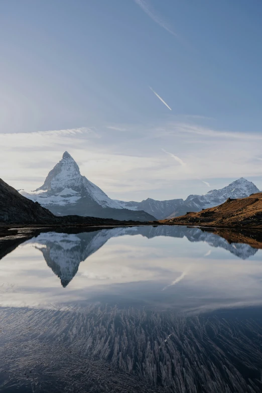 mountains and water at the foot of a flat expanse