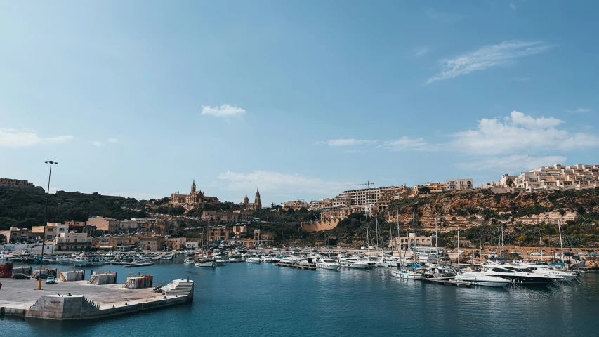 boats in a large body of water next to a city