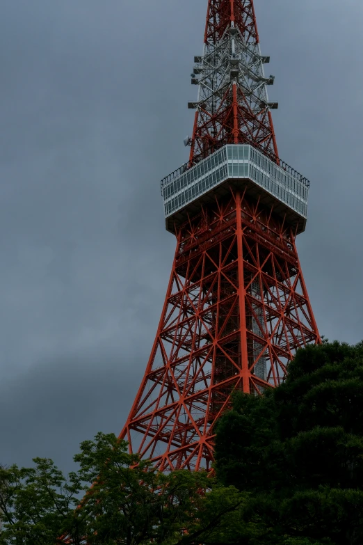 a tower with lights in the top is red