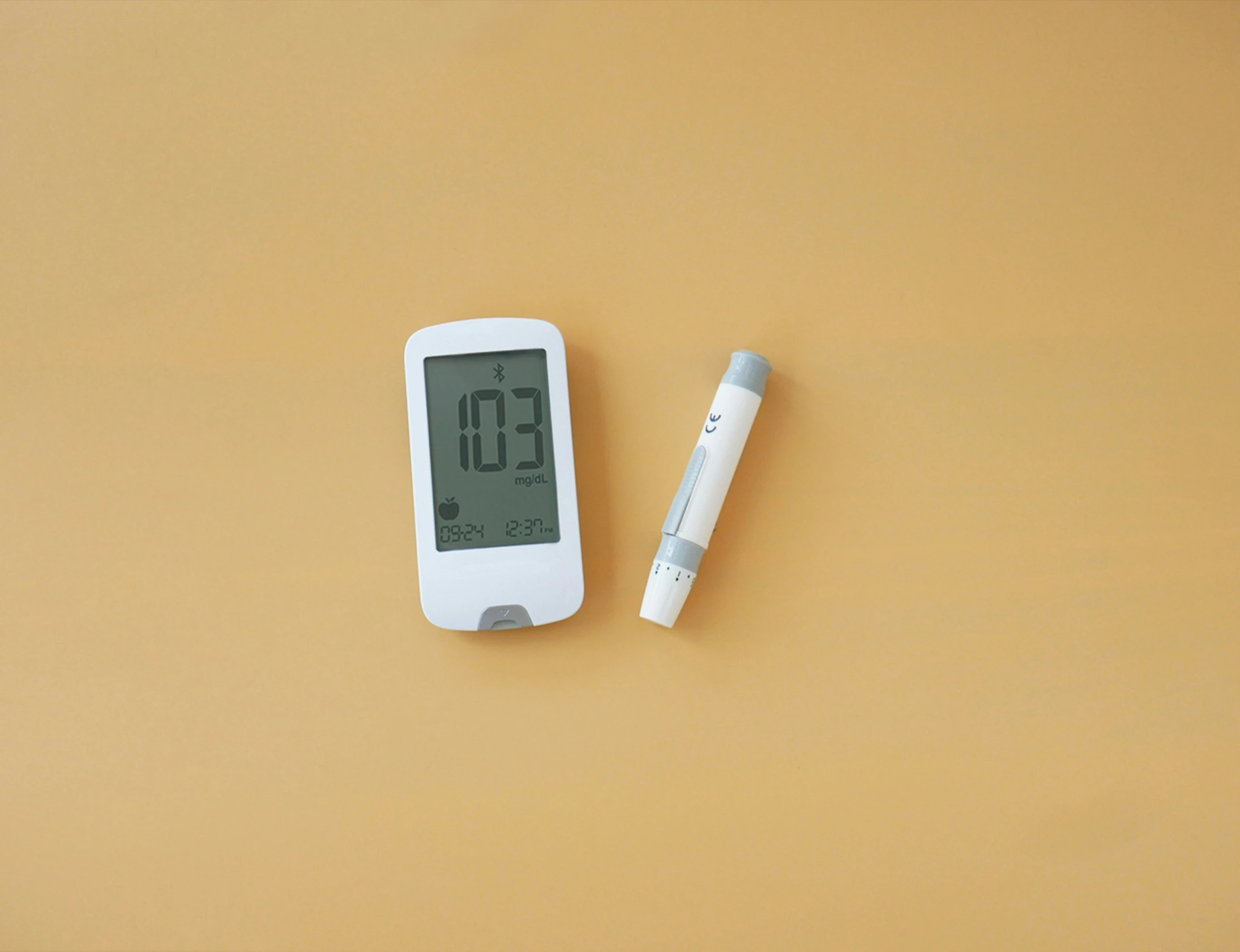 a thermometer and a toothbrush laying on a table