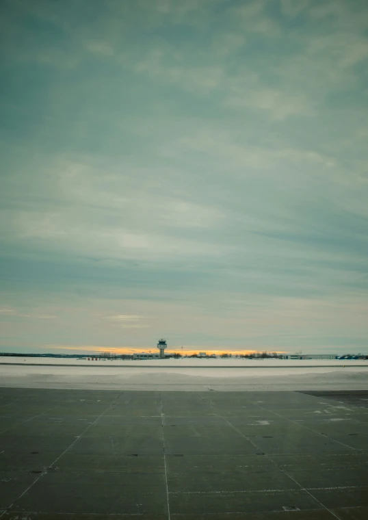 view from the runway over an empty airport runway