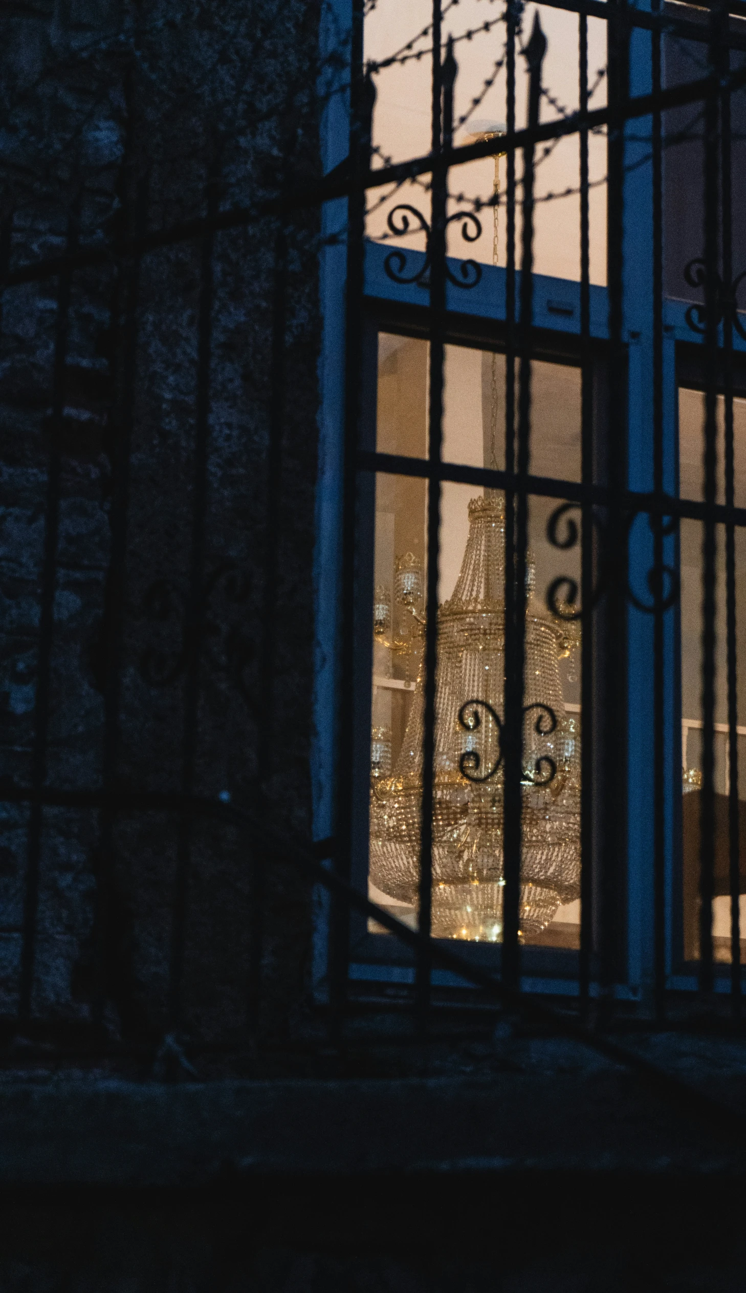 a window with a view of the city from inside at night