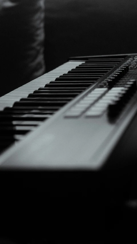 a black and white pograph of an electric piano