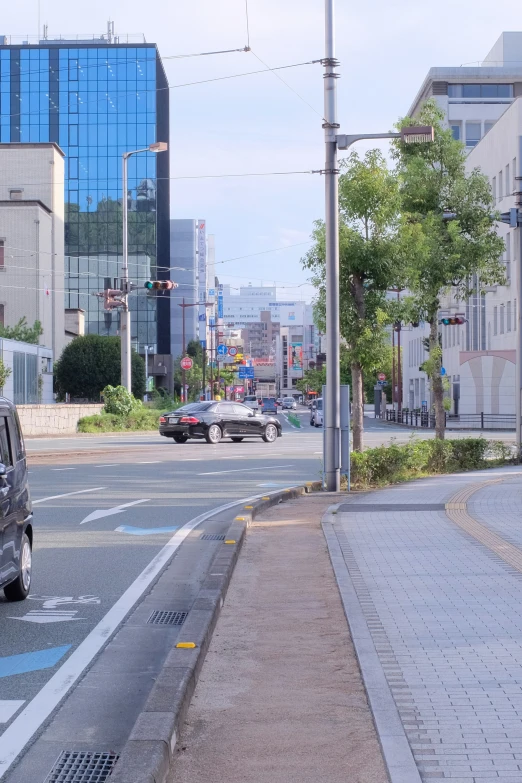 cars driving on an urban street in the daytime