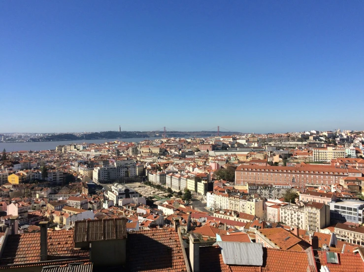 the view from the top of a building looking out over buildings and a city