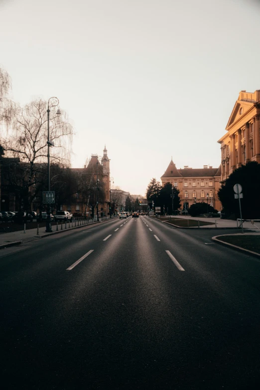 an empty street in the middle of a town