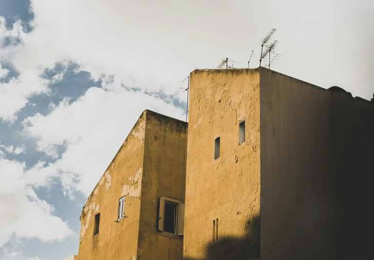 two stone buildings sitting next to each other