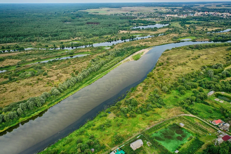 a river in an open space is shown with many land and water