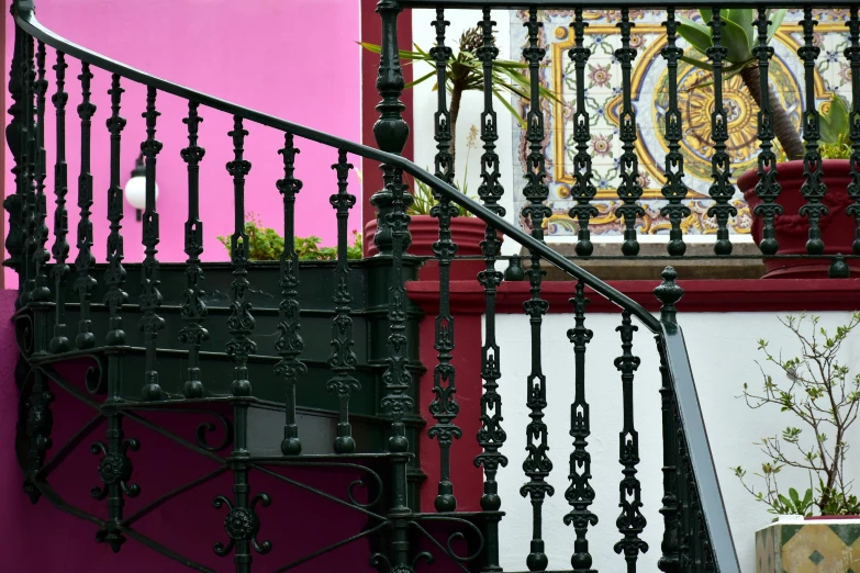 the balcony railing and the balconies give the home a dramatic, urban feel