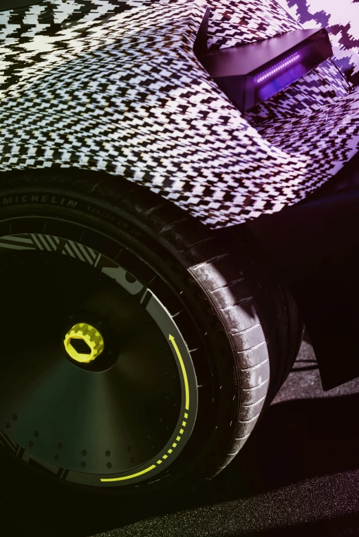 the back tire of a compact vehicle in a close up picture