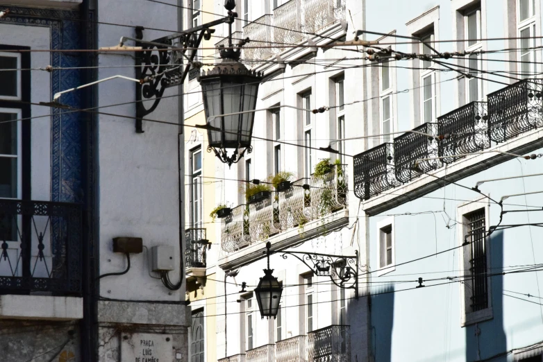 buildings in a city with multiple street lamps