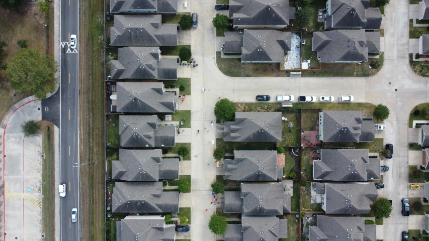 an aerial view of residential houses in the suburbs