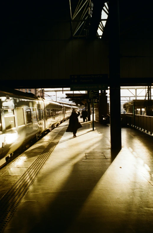 a train at a station waiting for passengers