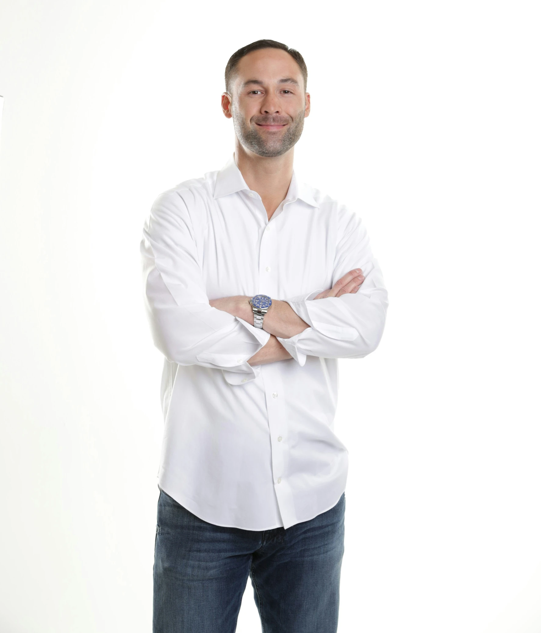 a man with a beard and glasses posing for a picture