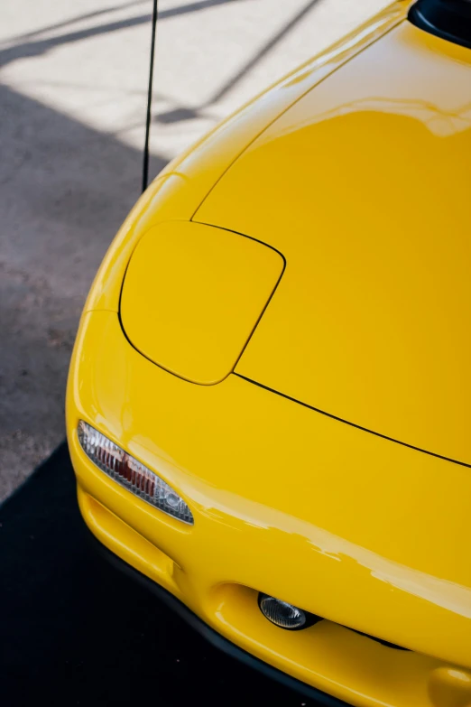 the hood of a car is shiny yellow