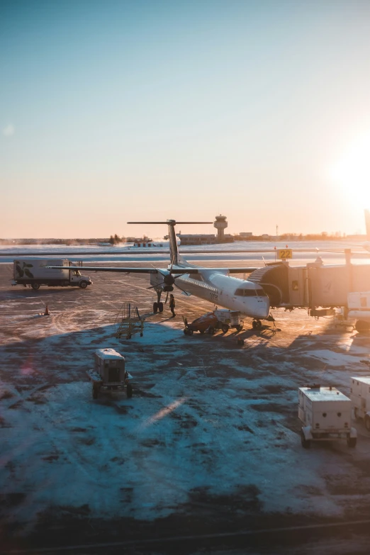 a plane sitting on a tarmac near other planes