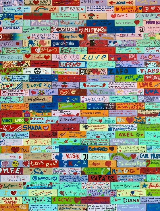 colorful words and hearts are printed on this wall