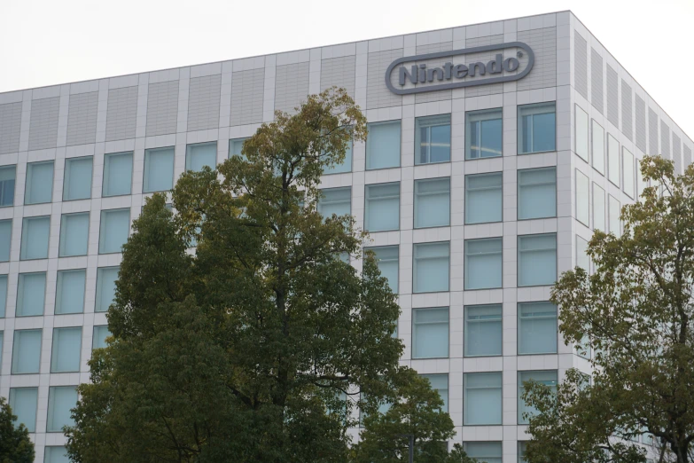 the logo on the front of a building with trees