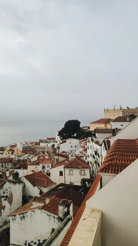 a white building with some brown roof tops