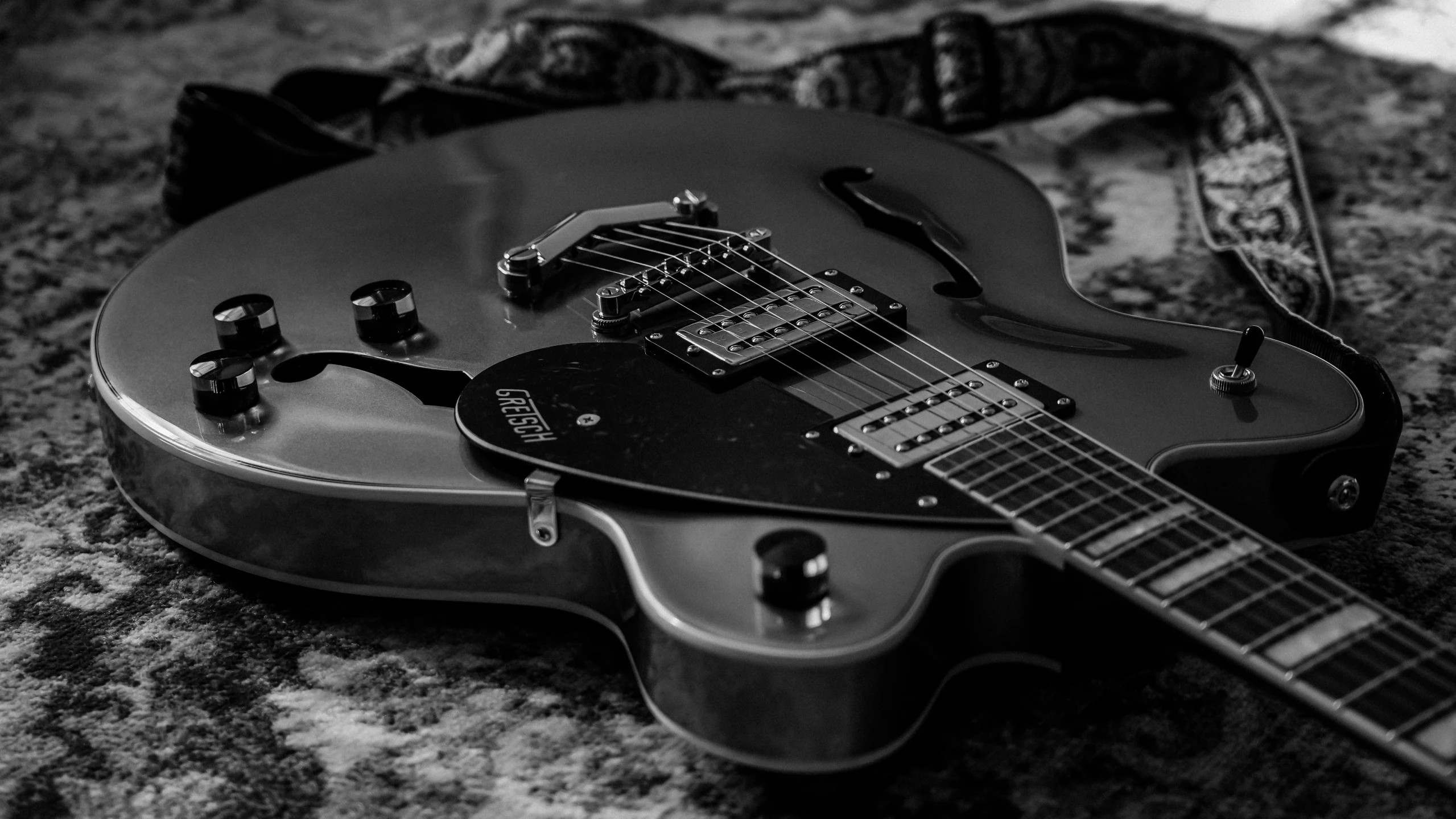 a black and white image of an electric guitar