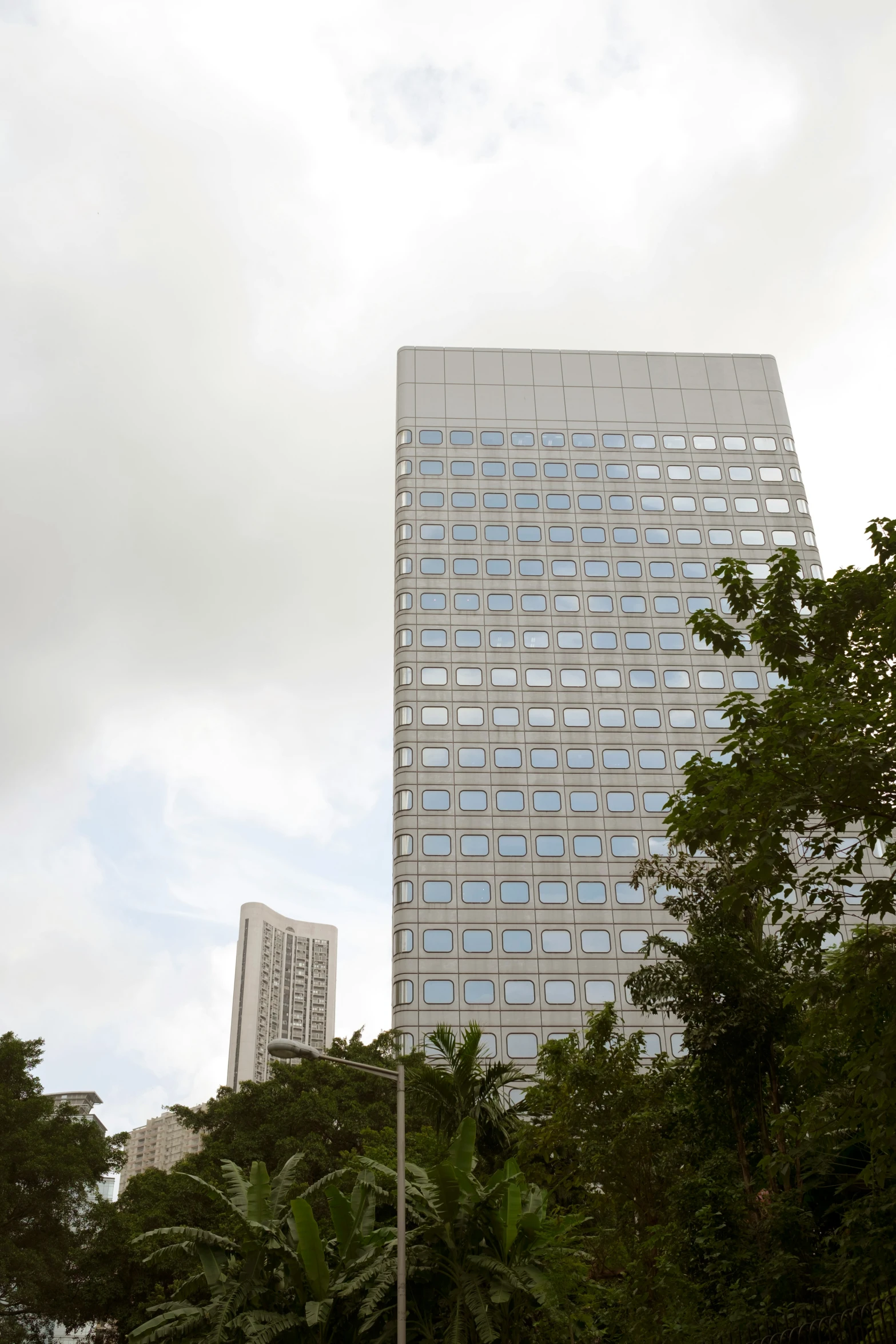 the top of a very large building towering over trees