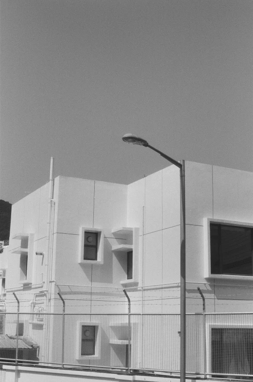 several white houses sit on the side of a road