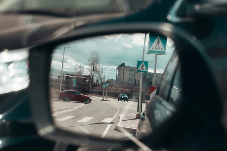 a reflection in the side mirror of a car's mirror