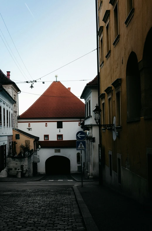 a couple of buildings and one car that is parked