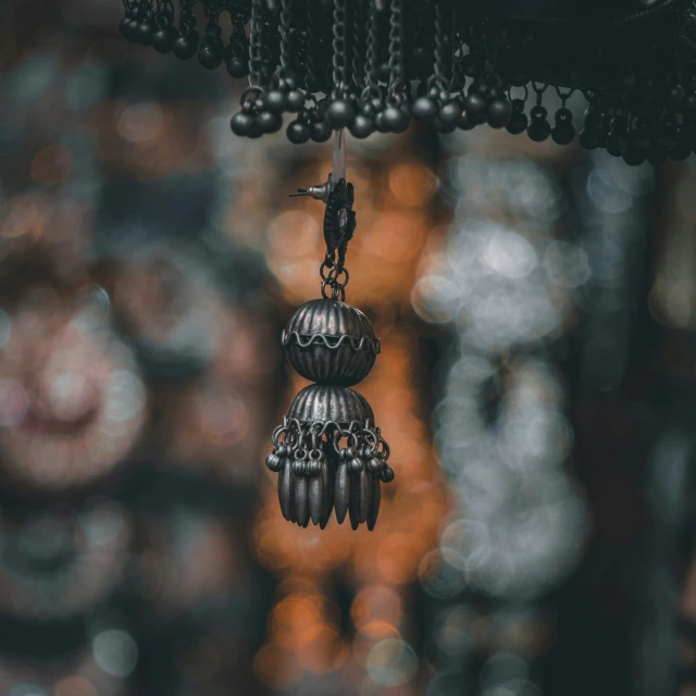 beads hanging from a chandelier hanger in an oriental market