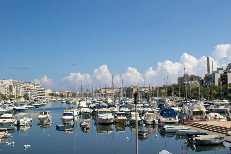 an marina with many boats parked at one end of the pier