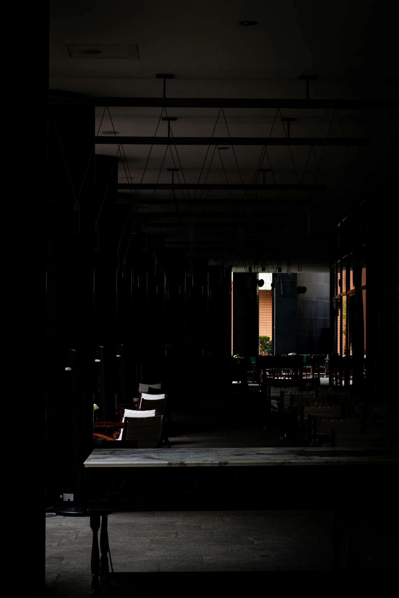 the sun coming through from a window illuminates a view of some chairs