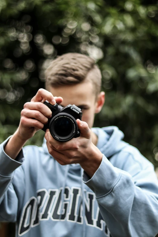 a person holding a camera taking a picture