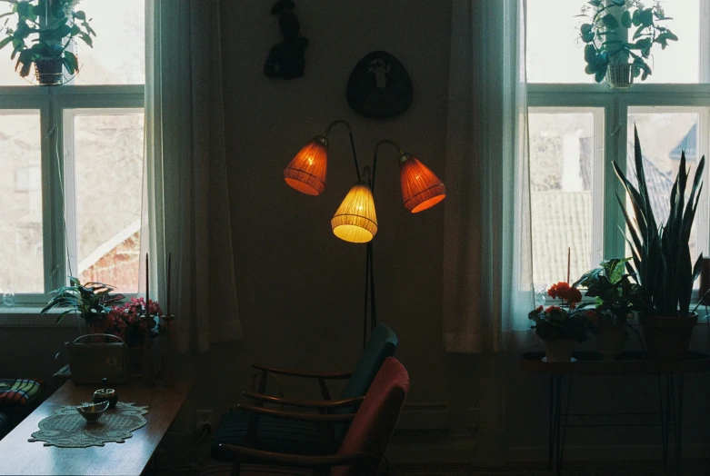 a room that has several lamp on the wall